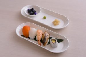 A light bites sushi option is offered to both First and Business Class customers